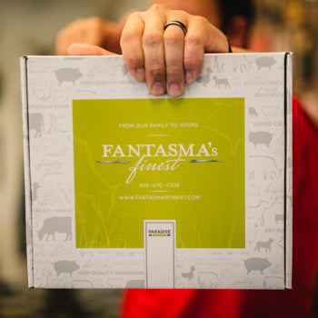 A man holding Holiday a Centerpieces and Gift Boxes