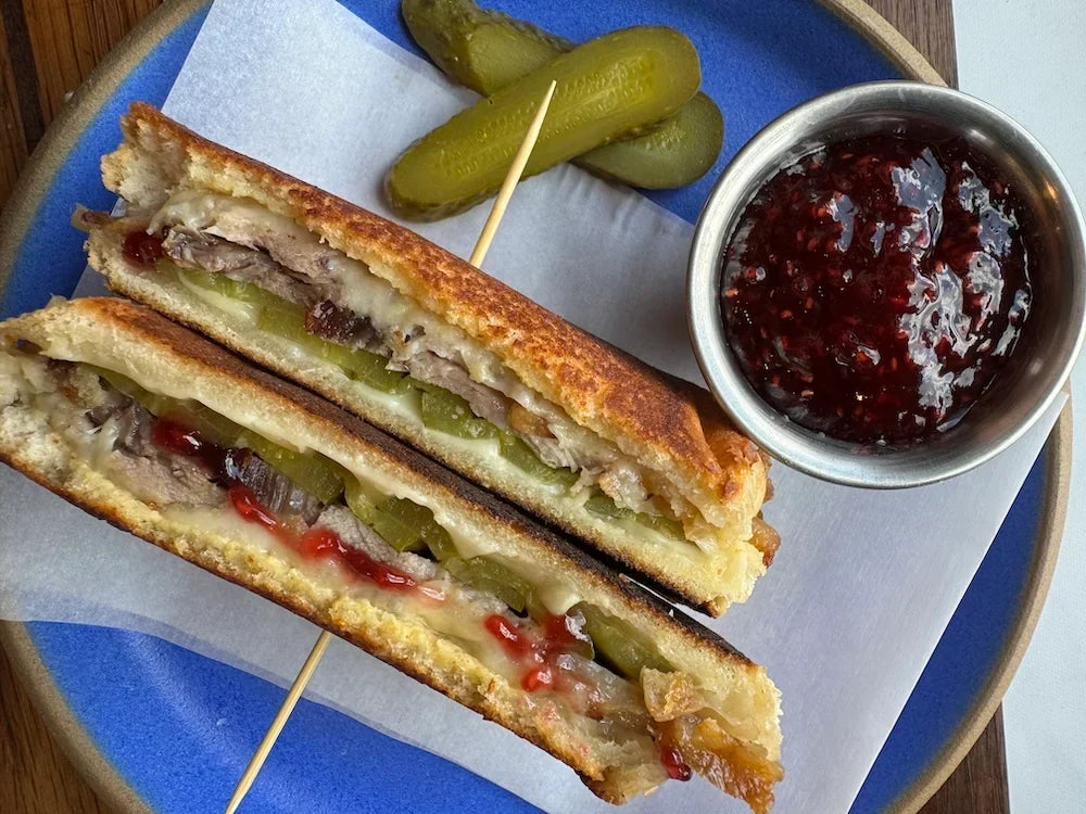 Berkshire pork belly leftovers in a grilled cheese with jam and pickles