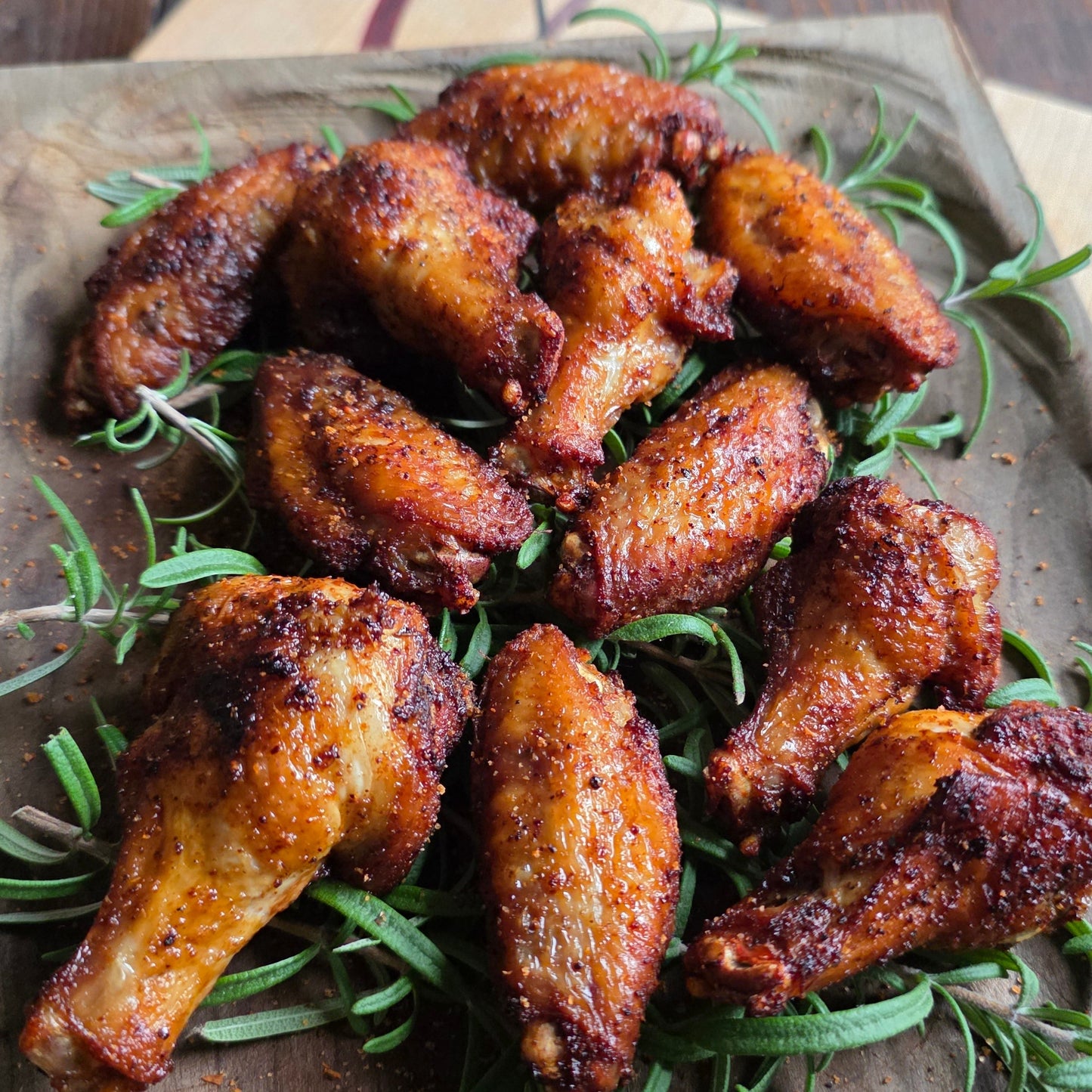 Cooked chicken wings with drums and flats on cutting board