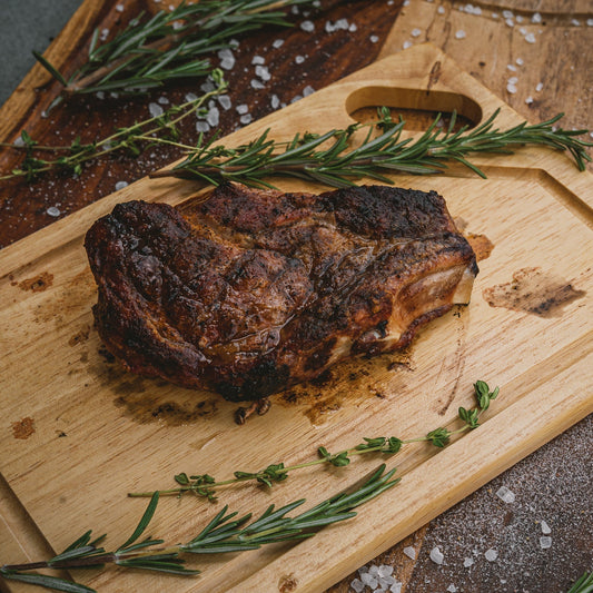 Grilled Pork Ribeye Chop on Cutting Board