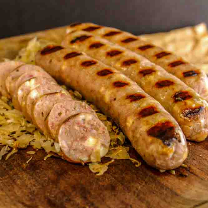 Reuben Bratwurst on a bed of cabbage