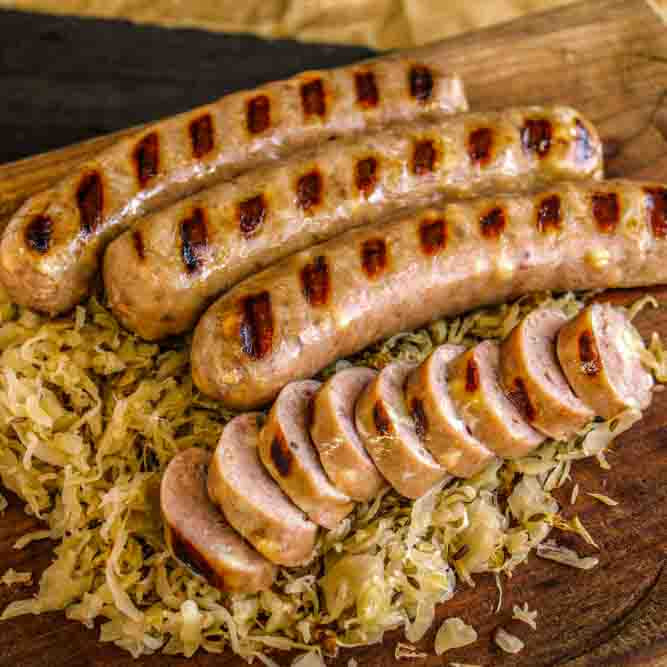 Reuben bratwurst on a bed of cabbage